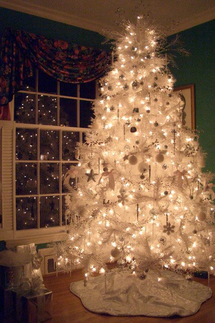 white-christmas-tree-in-dark-with-lights